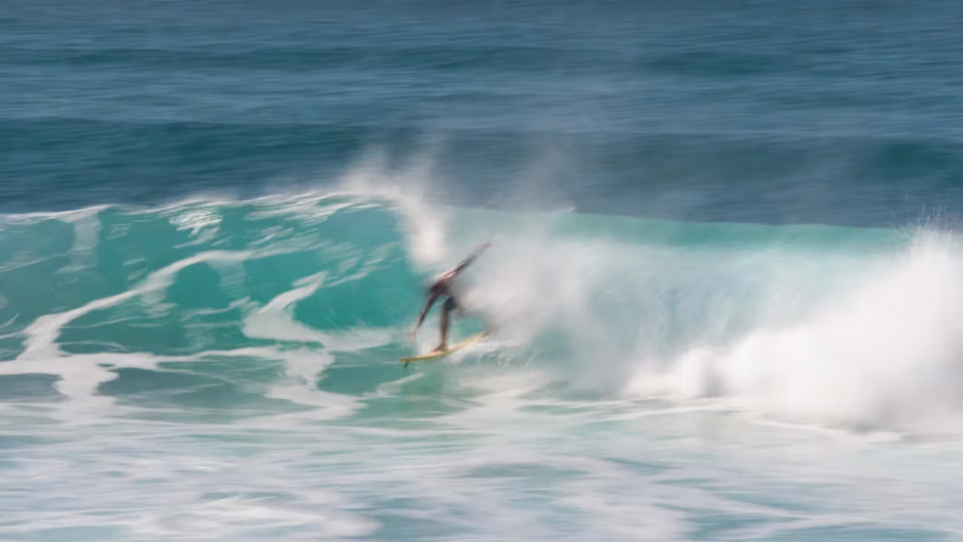 A well-timed duck dive lets surfers slip beneath incoming waves